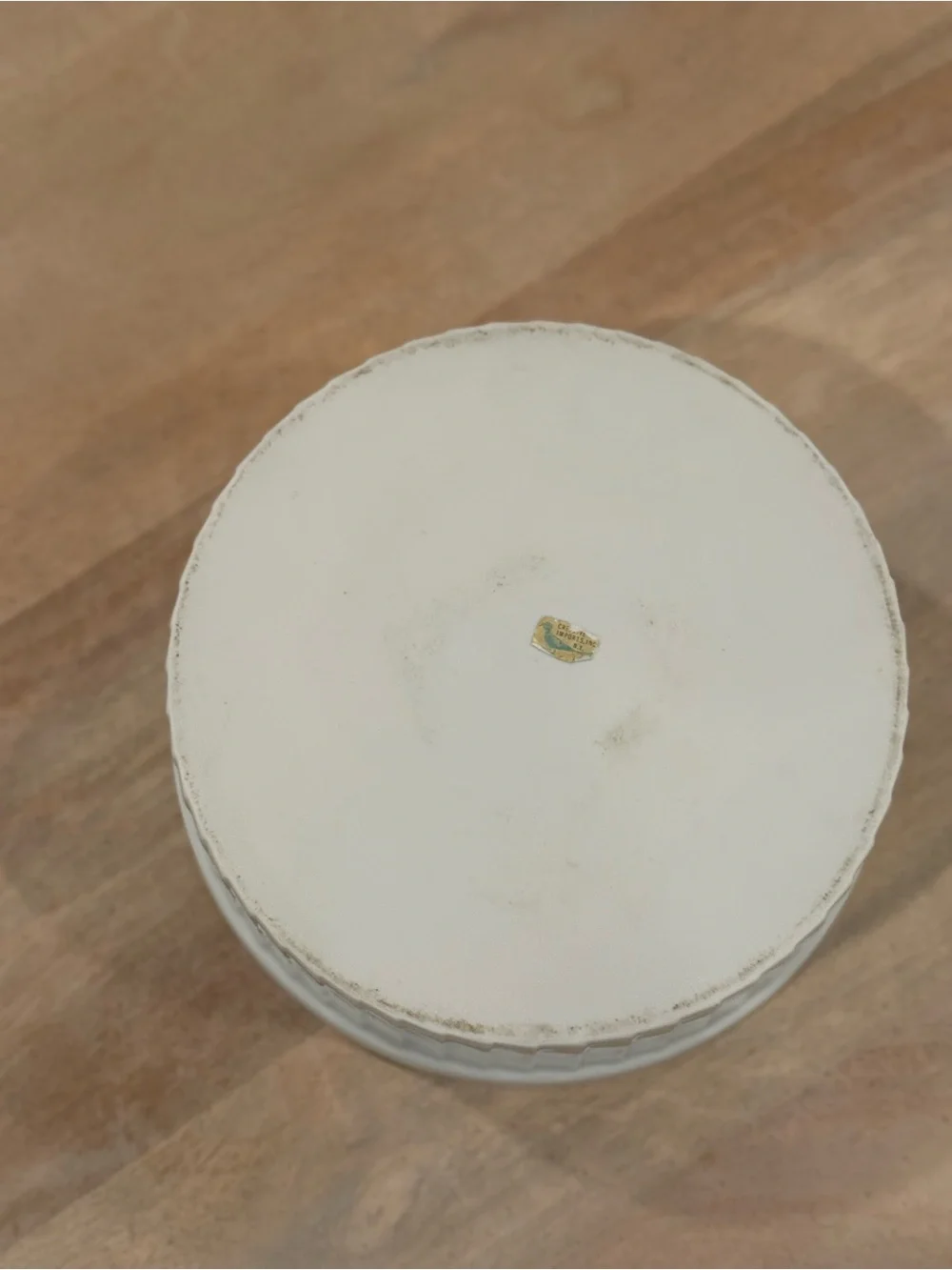White Ceramic Plate with Small Decorative Sticker